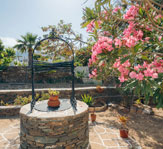 A well in the yard of Nostos rooms in Sifnos